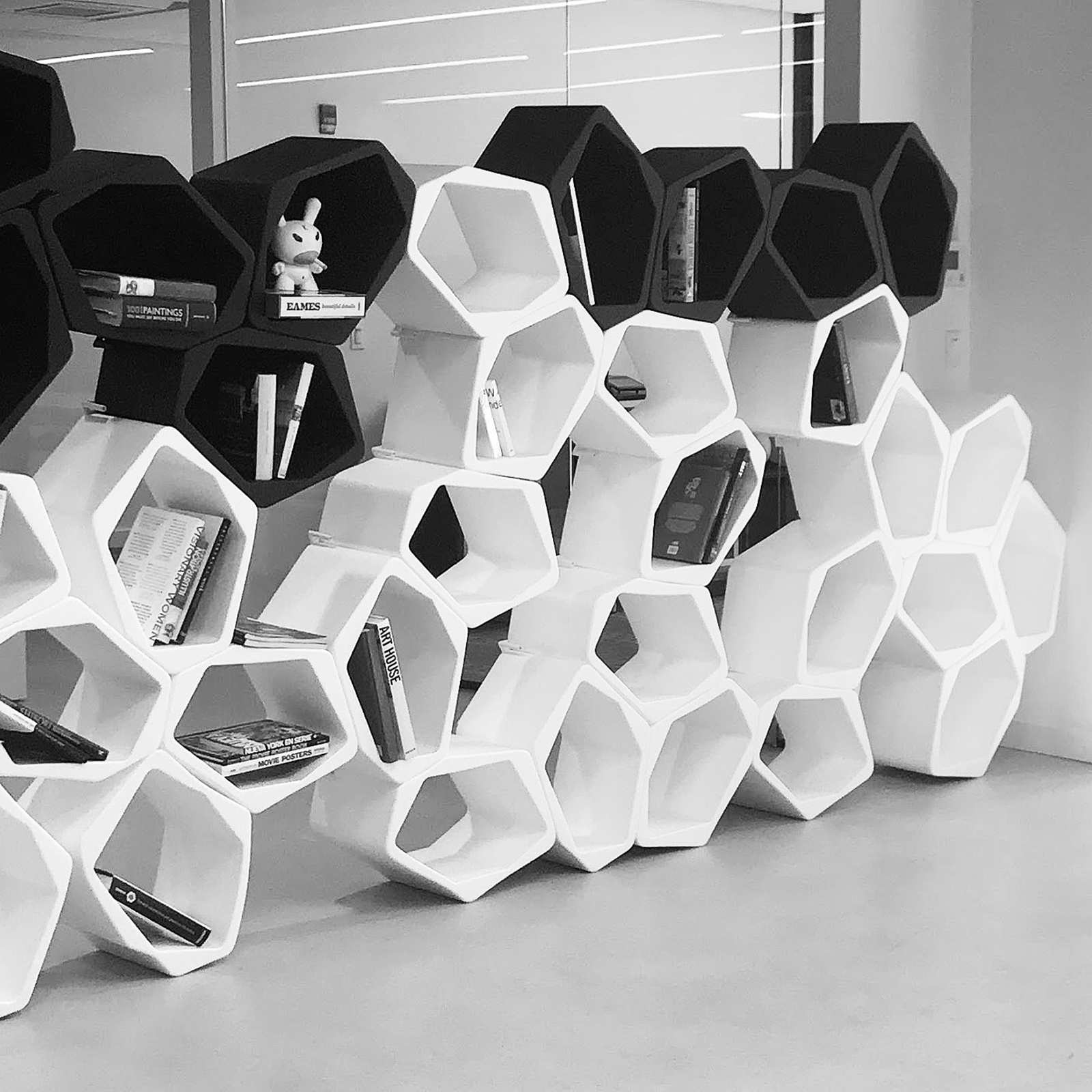 Open BUILD shelves as freestanding partition in an office