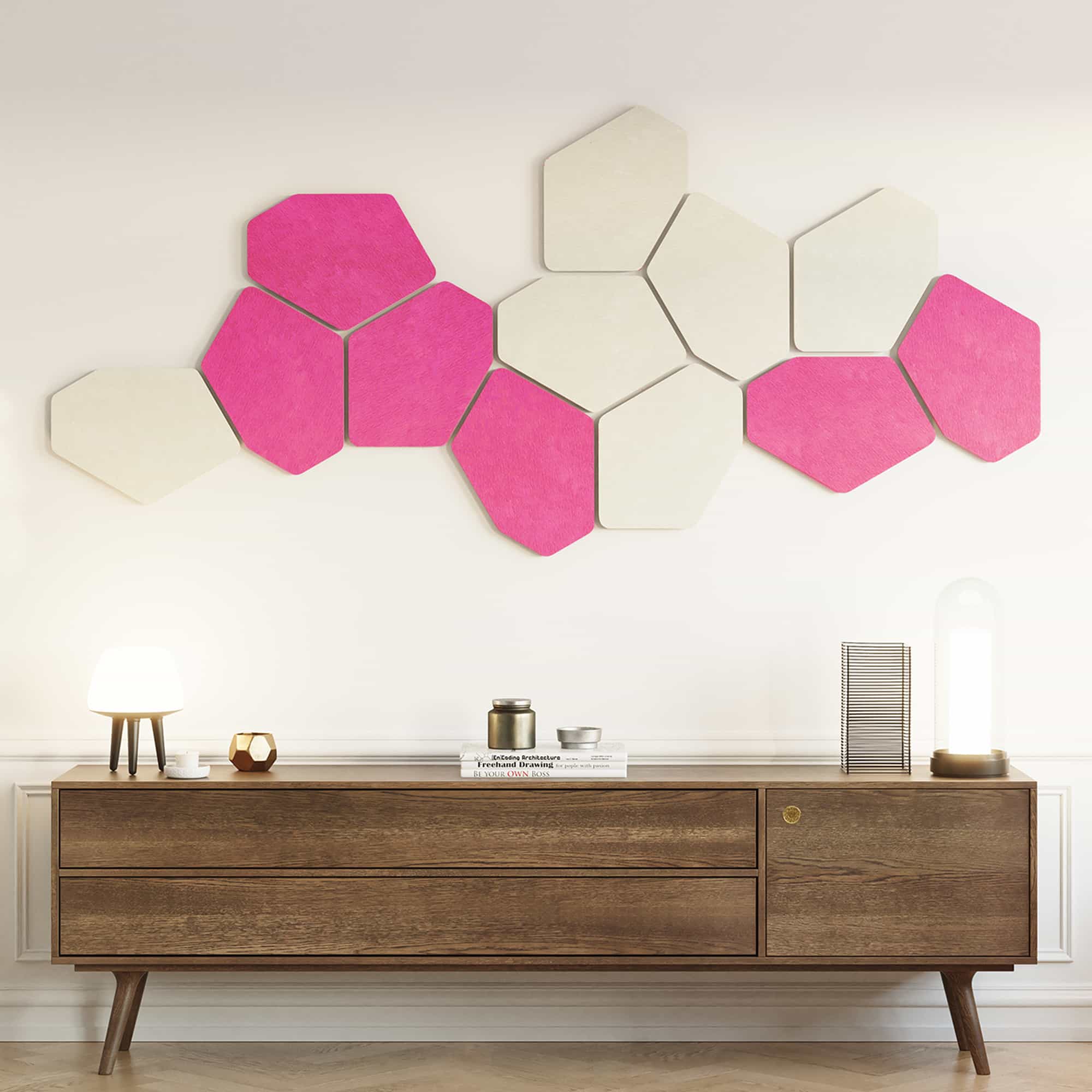 Hot pink and white hexagon acoustic wall panels above a wooden sideboard
