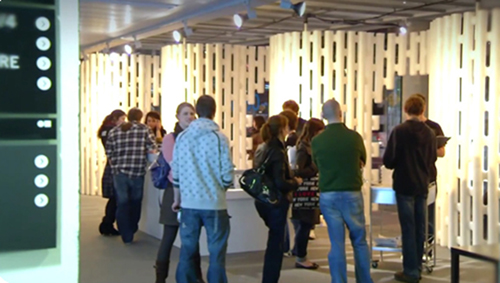 Round modular call pods built from white partition units at the Science Gallery, Dublin