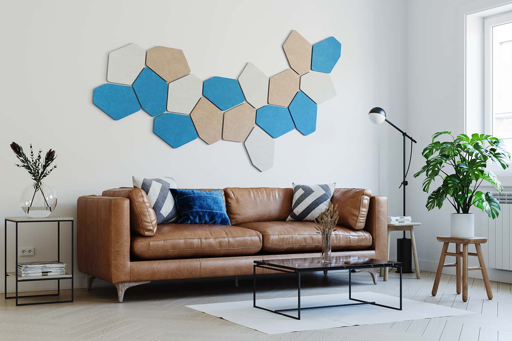 Decorative acoustic wall panels in Blue Pacific Ocean, Warm Stone and Milk White above a leather sofa in a modern living room