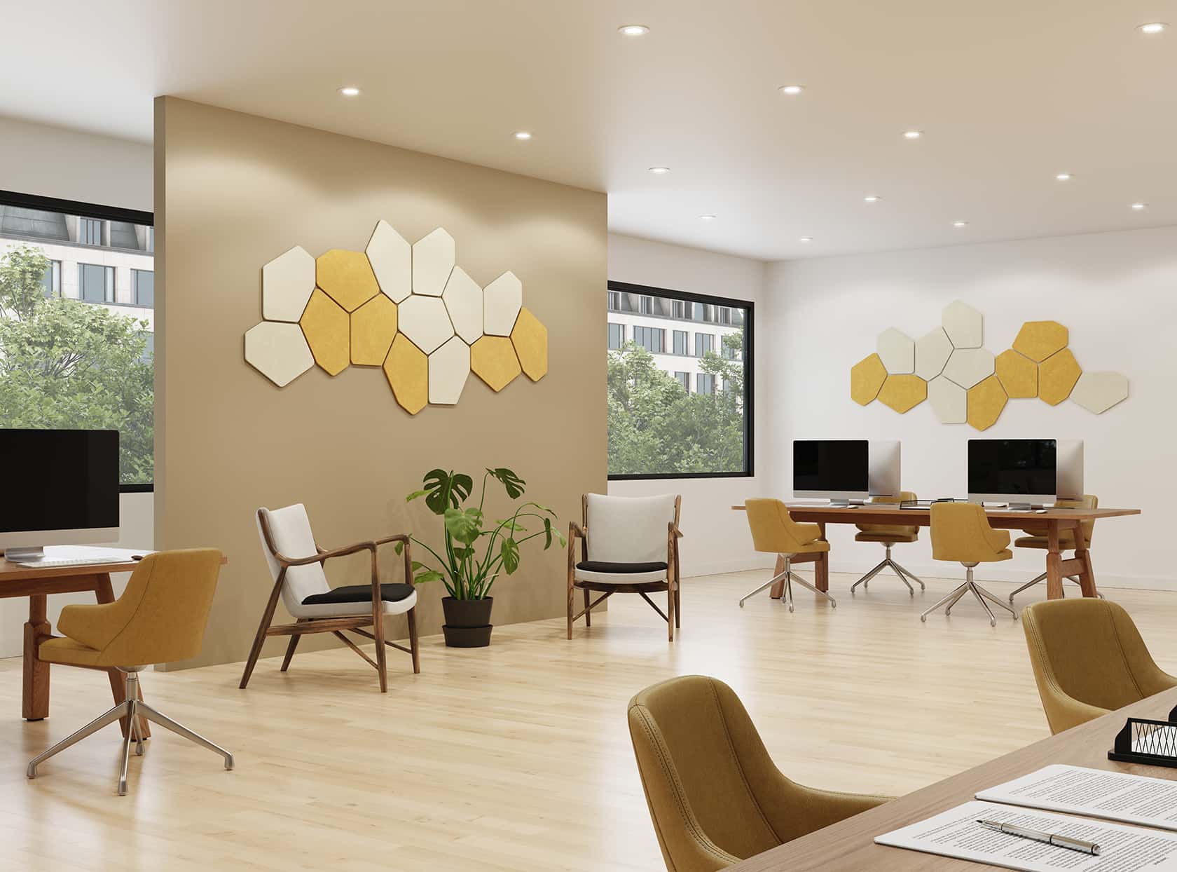 Hexagon acoustic wall panels in white and yellow above desks in a bright open-plan office
