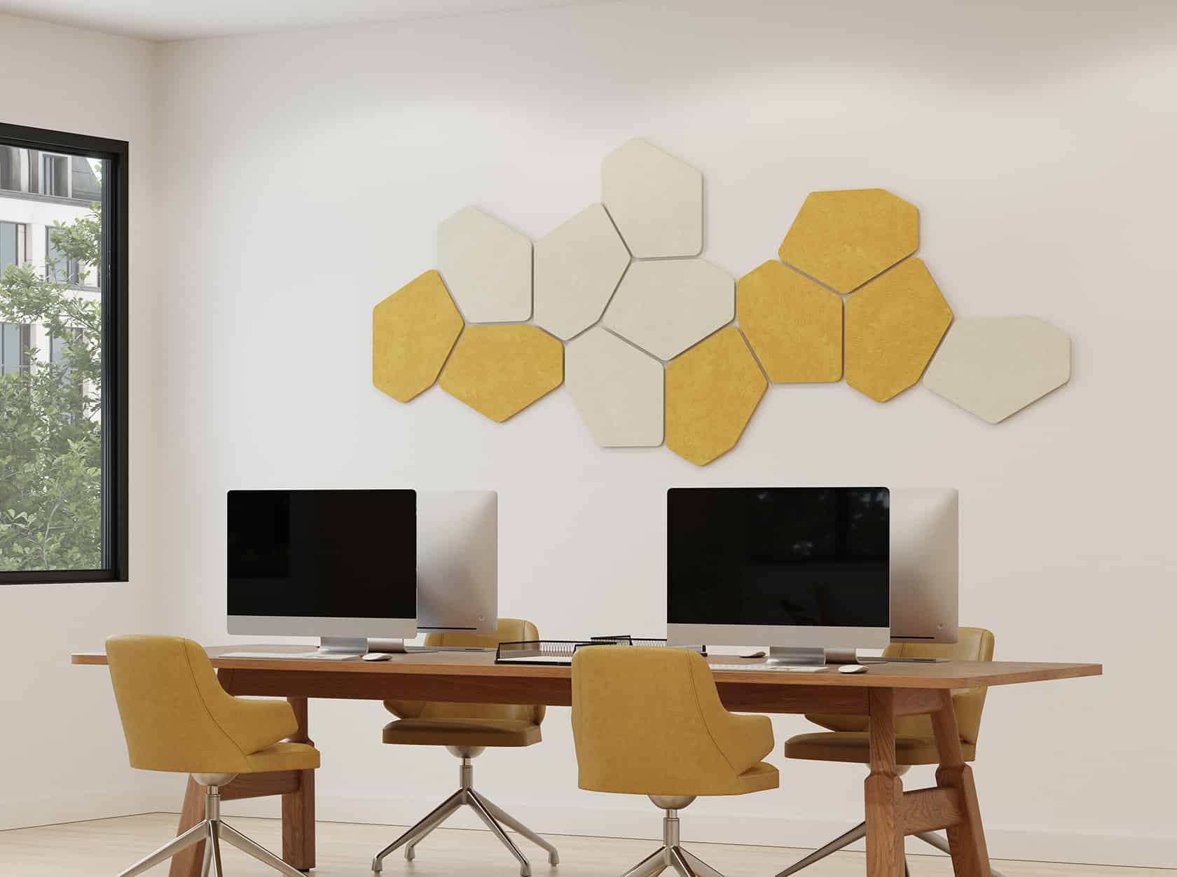Acoustic wall panels in yellow and white above a desk in a home office