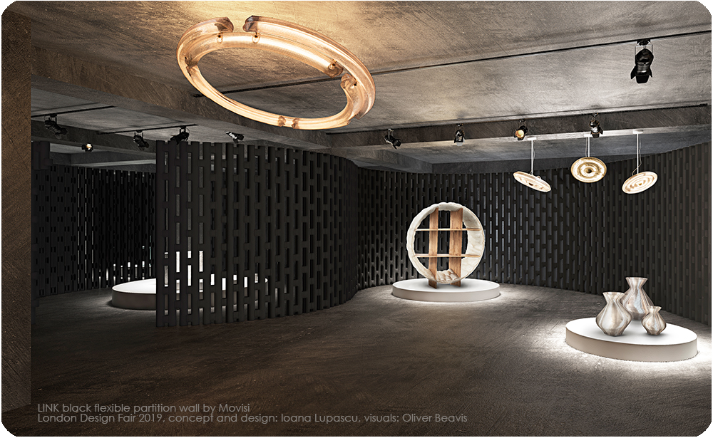 Black curved partition walls forming an exhibition space at the London Design Fair
