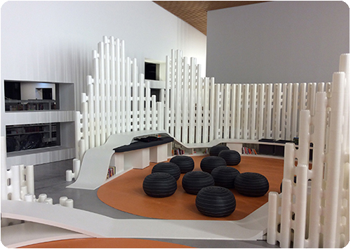 White modular room dividers around a reading zone at Saint-Malo Mediatheque