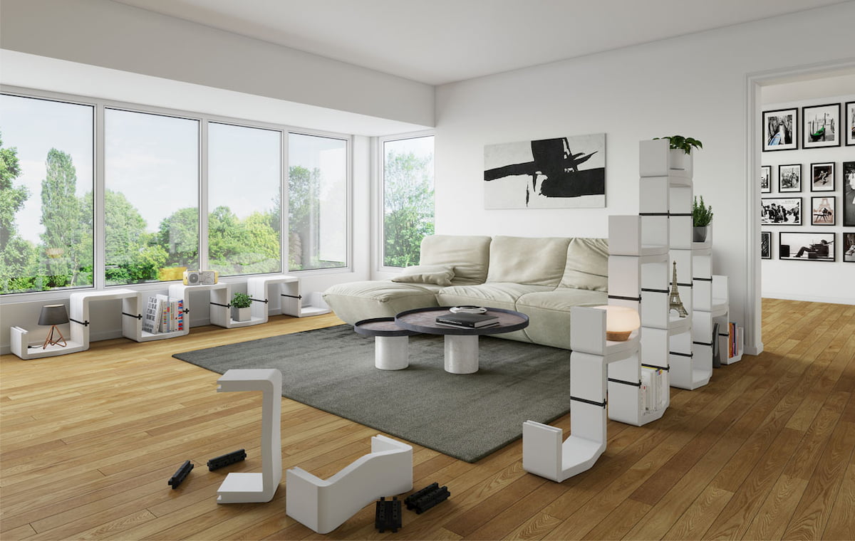 Wide white U-CUBE shelving unit dividing a living area
