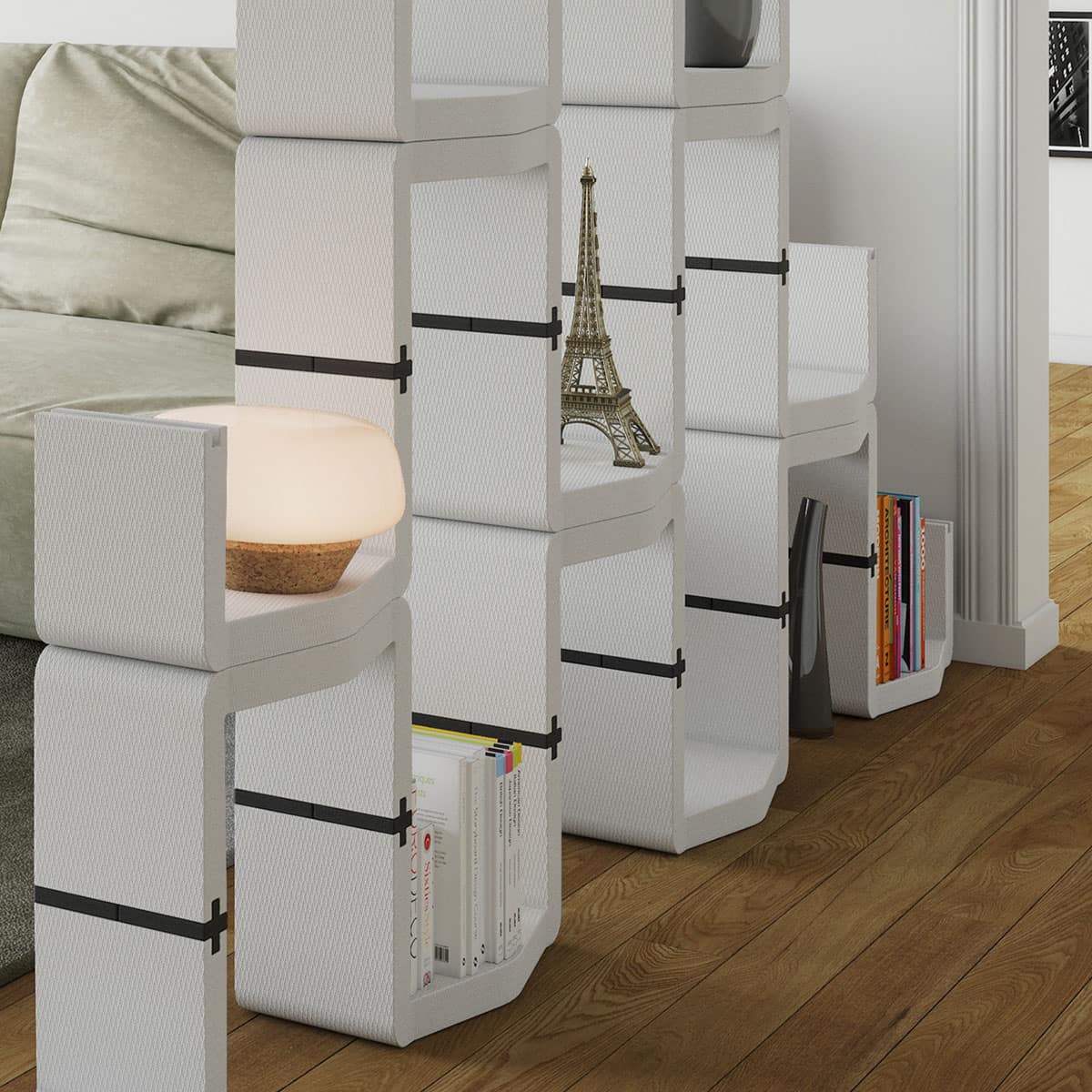 Narrow white U-CUBE shelves used as a freestanding room divider