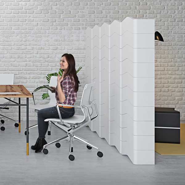 White freestanding U-CUBE partition wall separating a home office workspace