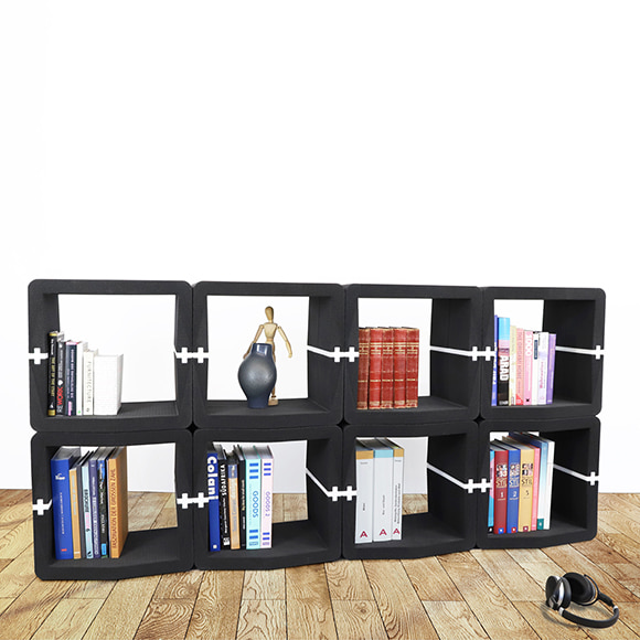 Black U-CUBE sideboard with books and decorations