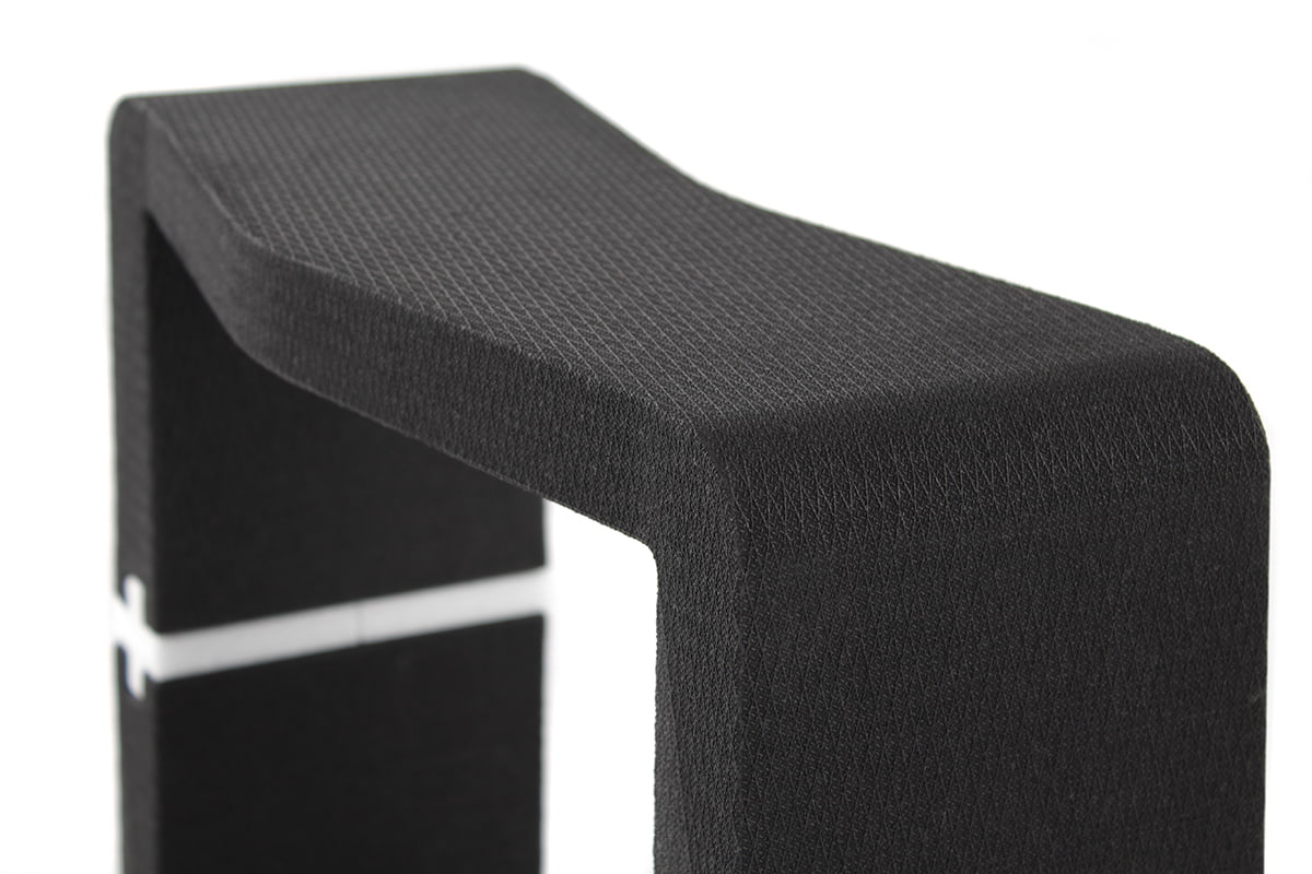 Black U-CUBE module showing the textured surface and rounded edges