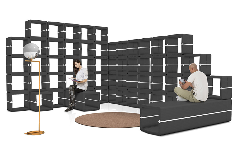 Black U-CUBE partition forming an informal meeting island in an office