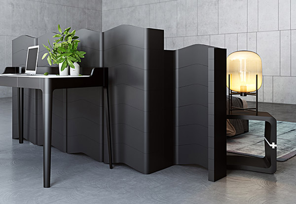 Black U-CUBE partition with bookshelves, bench and bedside table in a bedroom